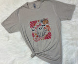 Gray t-shirt with a ghost and floral design on a white surface